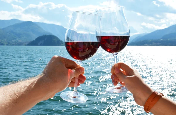 Two wineglasses in hands. — Stock Photo, Image