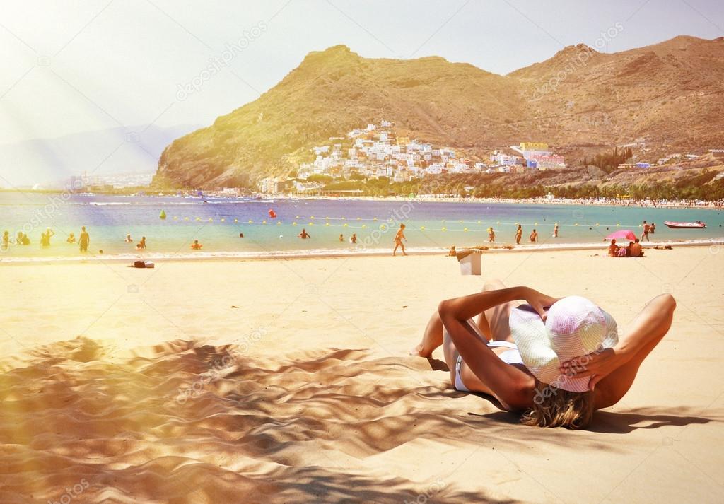 lying woman on beach