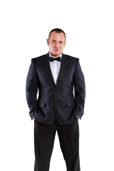 Joven hombre de negocios en traje sobre fondo blanco sonriendo . —  Fotos de Stock