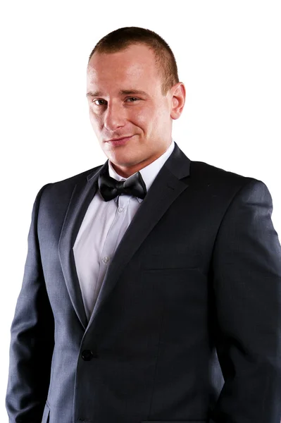 Young businessman in suit over white background smiling. — Stock Photo, Image