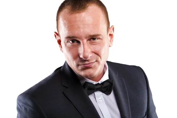 Young businessman in suit over white background smiling. — Stock Photo, Image