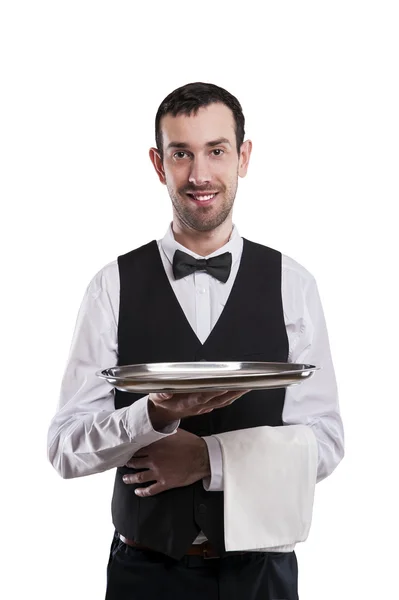 Waiter holding tray. Isolated over white background. Smiling but — Stock Photo, Image