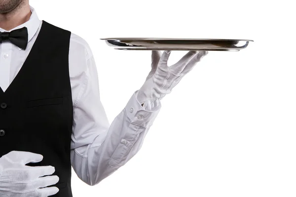 Рука официанта держит поднос на белом фоне . — стоковое фото
