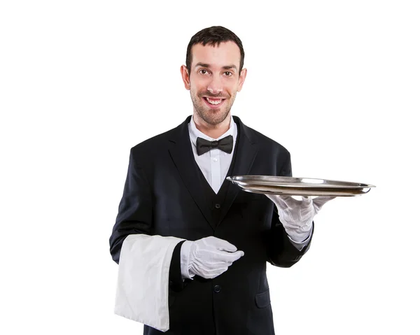 Kelner gospodarstwa taca. Na białym tle nad białym tle. Uśmiechnięty, ale — Zdjęcie stockowe
