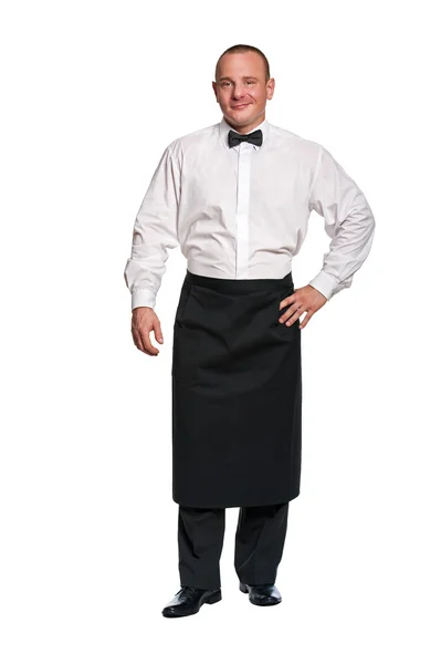 Man waiter standing aprone on isolation background. Smiling. — Stock Photo, Image