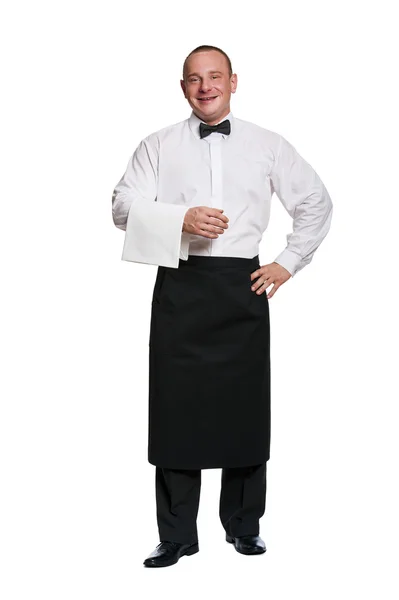 Man servitör stående förkläden på isolering bakgrund. Leende. — Stockfoto