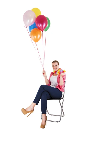 Mulher com balões sobre fundo branco sorrindo — Fotografia de Stock