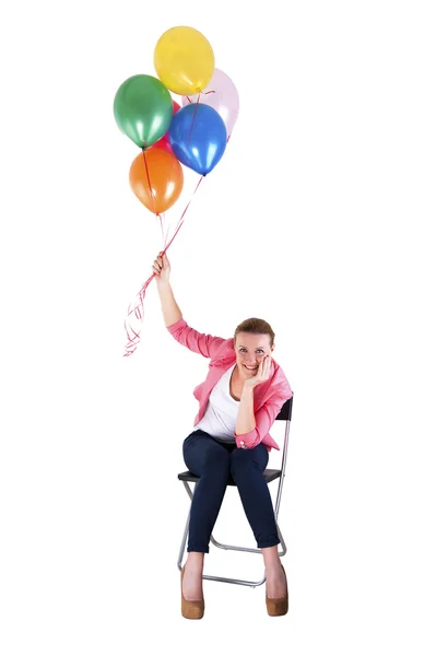 Frau mit Luftballons auf weißem Hintergrund lächelt — Stockfoto