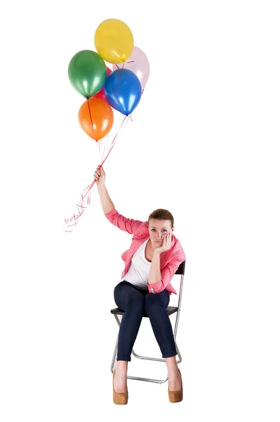 Woman with balloons over white background sad — Stock Photo, Image