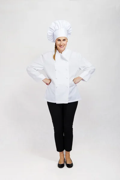 Joven chef profesional mujer. Aislado sobre fondo blanco — Foto de Stock