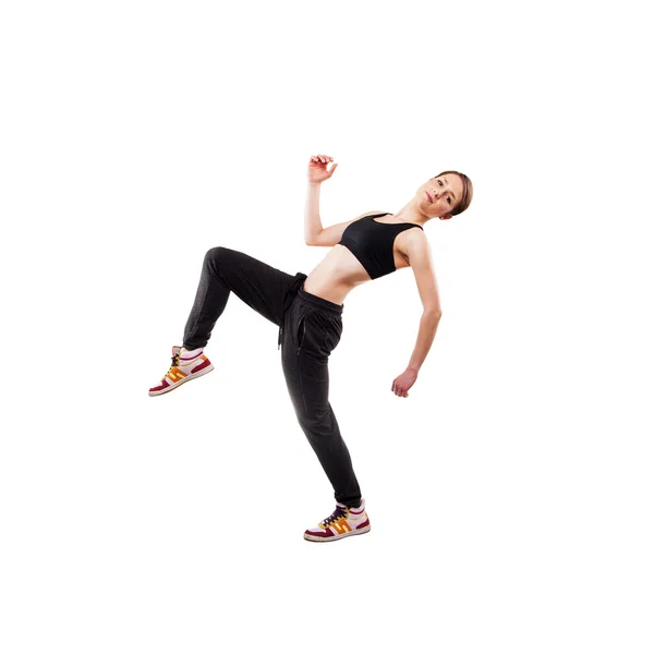 Stüdyo arka planında topallayan bacak pozu veren modern stil dansçısı — Stok fotoğraf