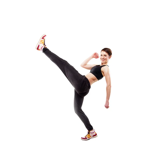 Bailarina de estilo moderno posando pierna hodling en fondo de estudio — Foto de Stock