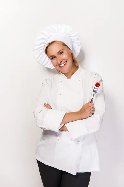 Woman chef showing a sign perfect, with tomato on fork, over whi — Stock Photo, Image