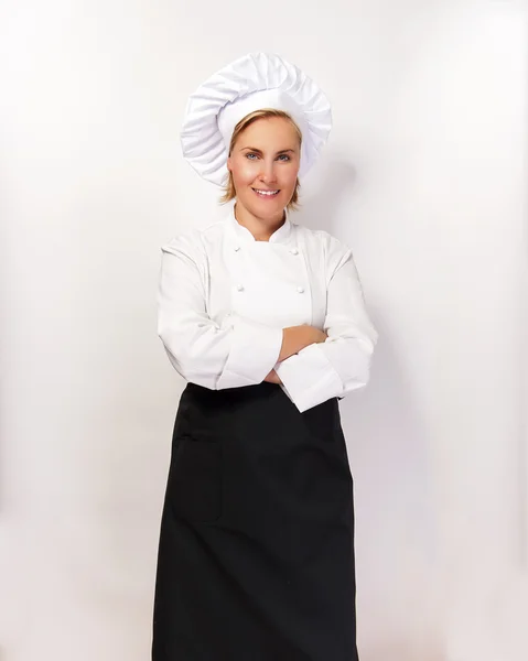 Mujer chef sonriendo sobre bacground blanco . — Foto de Stock
