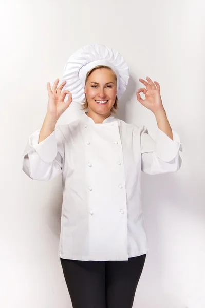 Woman chef showing sign perfect both hands over whita background — Stock Photo, Image