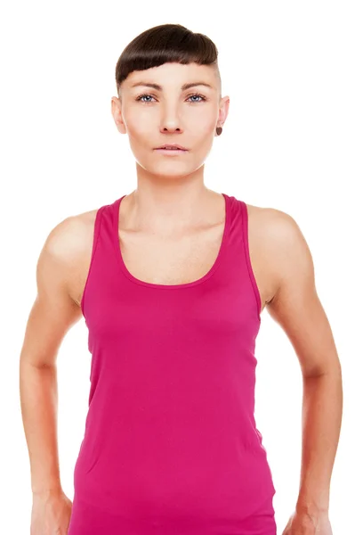 Portrét mladé ženy nad bílou ženu v fitness oblečení. — Stock fotografie