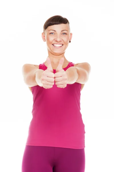 Portriat de mujer fitness con los pulgares hacia arriba. Aislado sobre blanco ba — Foto de Stock