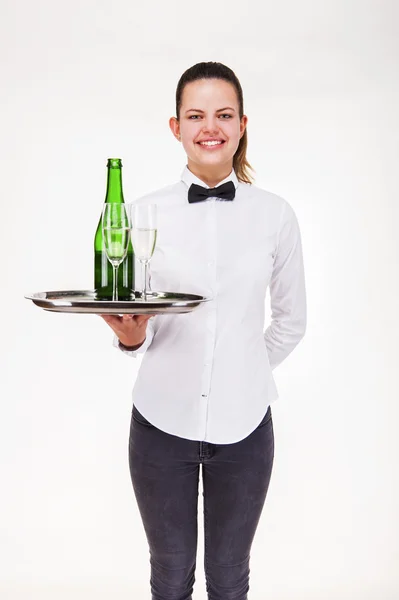 Woman in waiter uniform holding tray and glasses with champagne, — Stock Photo, Image