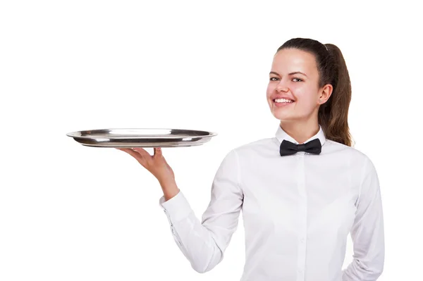 Mujer joven en bandeja de sujeción uniforme camarero aislado sobre blanco b — Foto de Stock