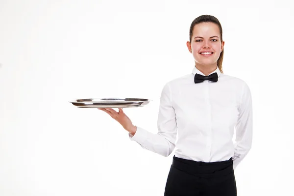 Mujer joven en bandeja de sujeción uniforme camarero aislado sobre blanco b — Foto de Stock