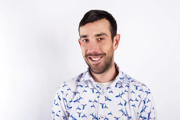 Man portrait over white background smiling. Black hair and facia — Stock Photo, Image