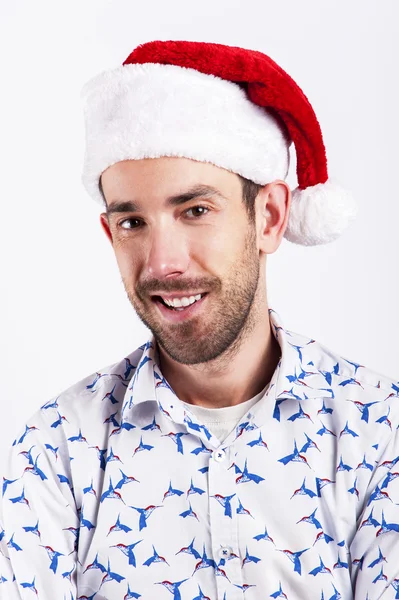 Muž v Santa klobouk přes bílé pozadí. — Stock fotografie