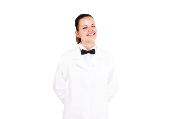 Scince woman in lab coat and bow tai smiling over white backgrou — Stock Photo, Image