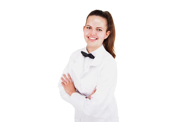 Scince woman in lab coat and bow tai smiling over white backgrou — Stock Photo, Image