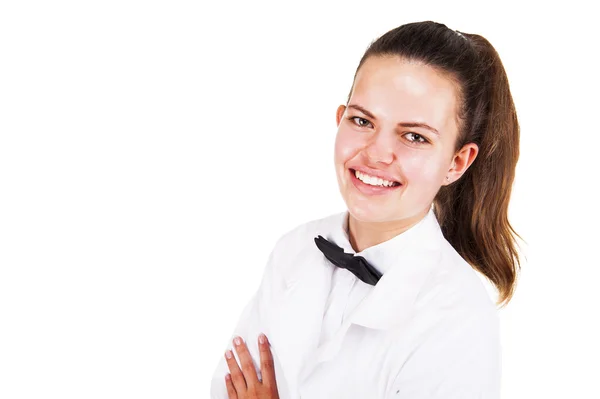 Scince woman in lab coat and bow tai smiling over white backgrou — Stock Photo, Image