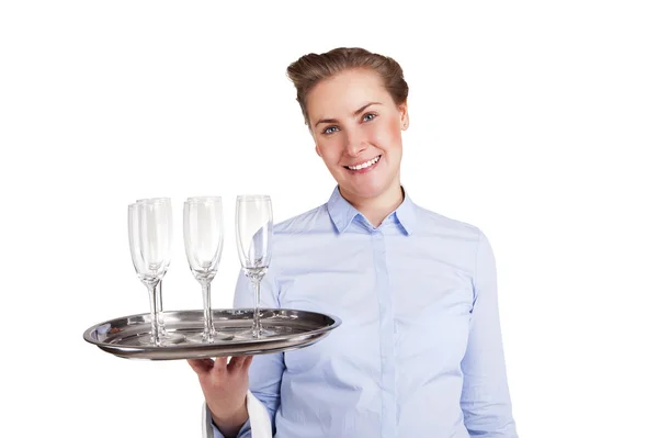 Woman in waiter uniform holding tray with glasses, smiling, isol — Stock Photo, Image