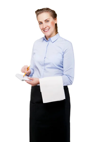 Femme en uniforme de serveur prenant l'ordre, souriante, isolée sur Blanc — Photo