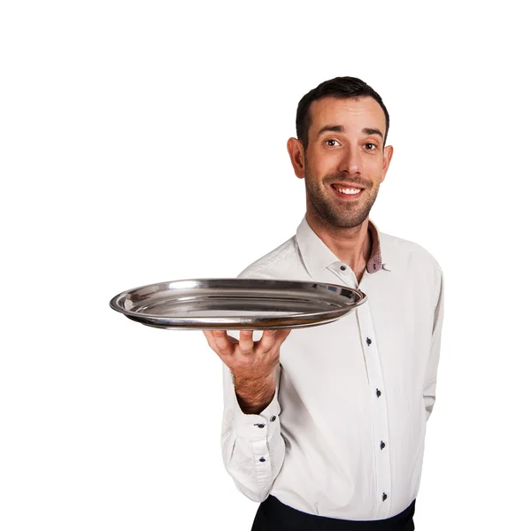 Garçom segurando bandeja com sorriso, isolado sobre fundo branco . — Fotografia de Stock