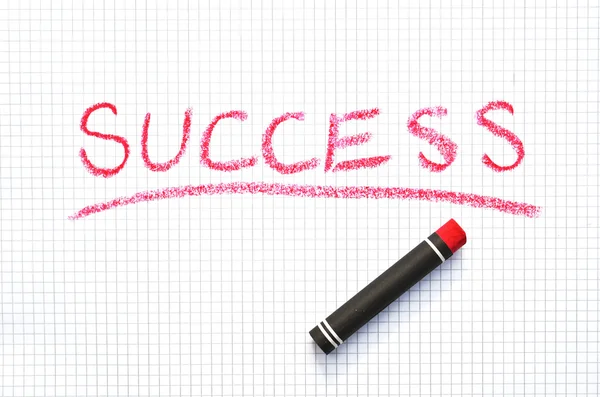 SUCCESS writing on the checkered paper — Stock Photo, Image