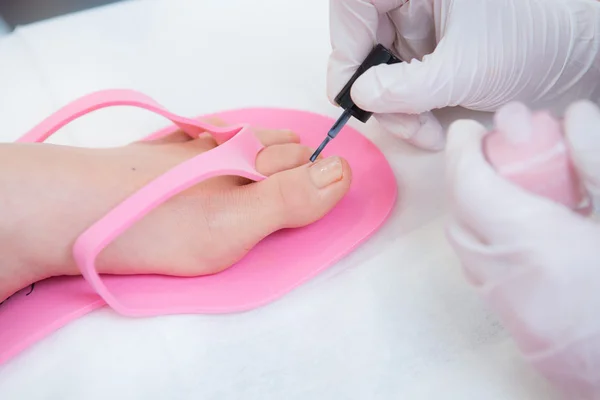 While applying the polish to toenails — Stock Photo, Image