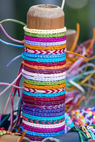 Selection of color thread bracelets — Stock Photo, Image