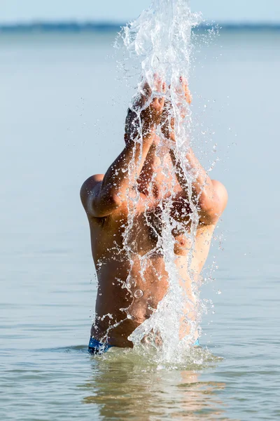 Young men in the lake — Stock Photo, Image