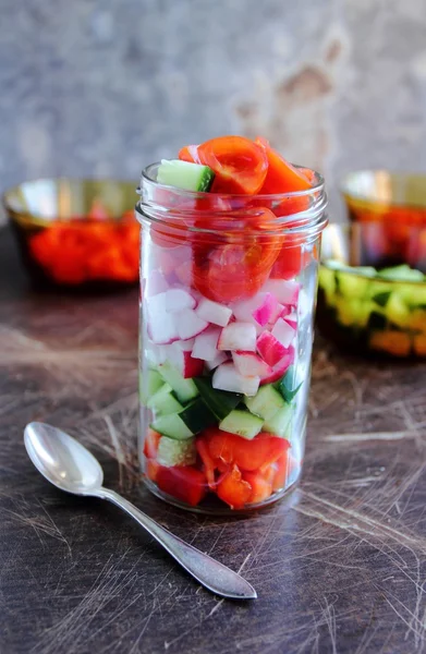 Small jar with fresh vegetables — Stock Photo, Image