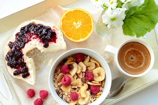 Tray with breakfast. Coffee, bread with jam, cereals and fruits — Stock Photo, Image