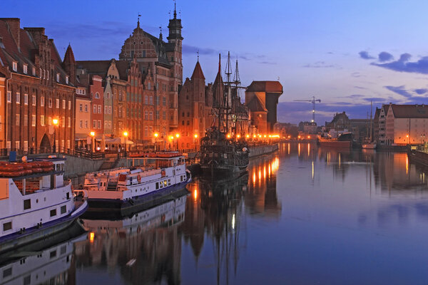 Old Town of Gdansk at Motlawa River with beautiful riverside and famous crane