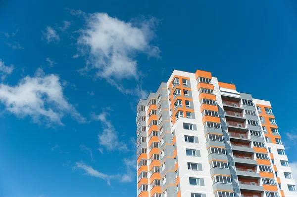 High-rise house on blue sky background