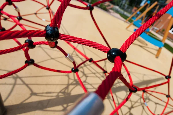 braided red ropes and knots close-up on the Playground