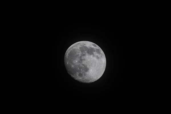 full large moon on a black background at night. full moon