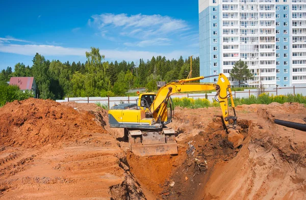 Żółty Koparka Kopie Ziemię Placu Budowy Zdjęcia Stockowe bez tantiem