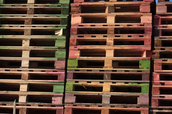Stacked wooden pallets at a pallet warehouse