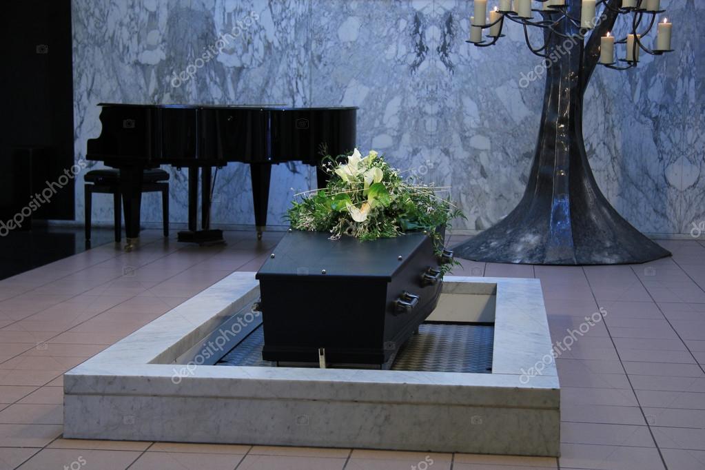 Coffin with funeral flowers — Stock Photo © portosabbia #52362597