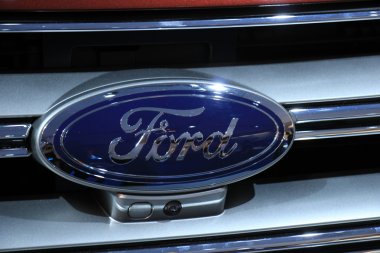 Amsterdam, The Netherlands - April 23, 2015: Ford logo on displa clipart