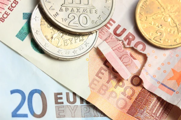 Greek coins on euro notes — Stock Photo, Image