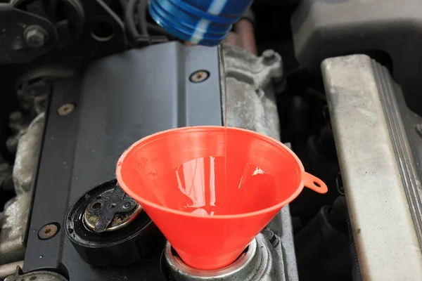 Oil refill with funnel — Stock Photo, Image