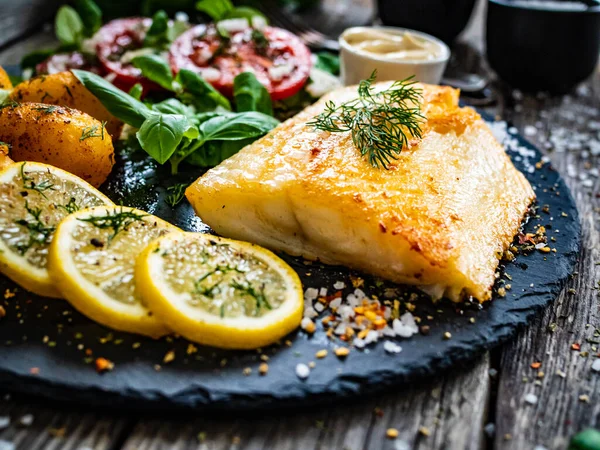 Fish Dish Fried Cod Fillet Potatoes Vegetable Salad Served Stone — Stock Photo, Image