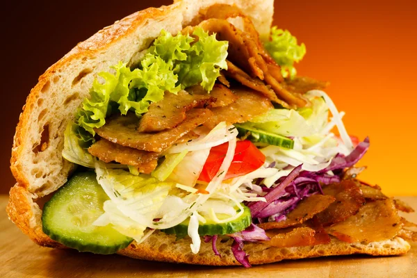 Kebab - grilled meat, bread and vegetables Royalty Free Stock Photos